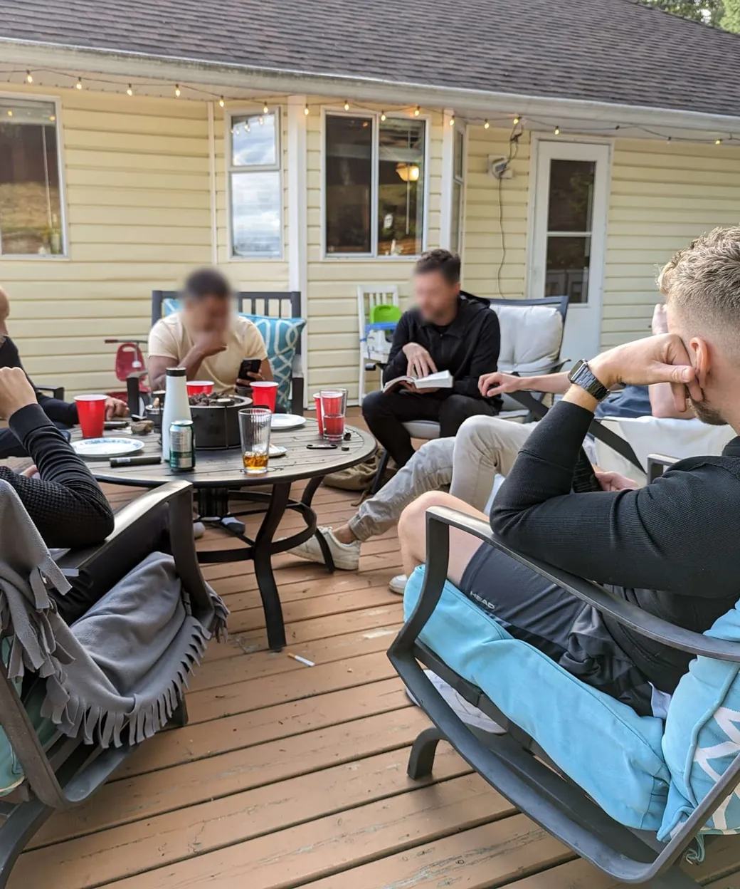 Members at an in-person Bible study on a deck